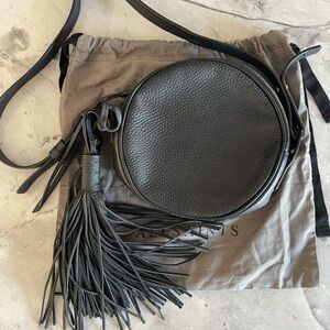 Round Black Leather All Saints Crossbody Bag with detachable tassels